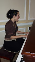 Unwoman graces us with a song on the hallway piano