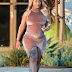 Blac Chyna shows of her growing baby bump