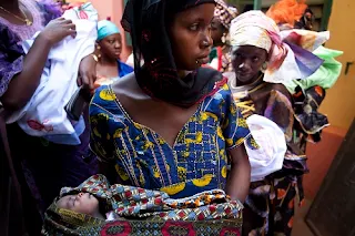 Measles outbreak Africa mothers wait to vaccinate their babies