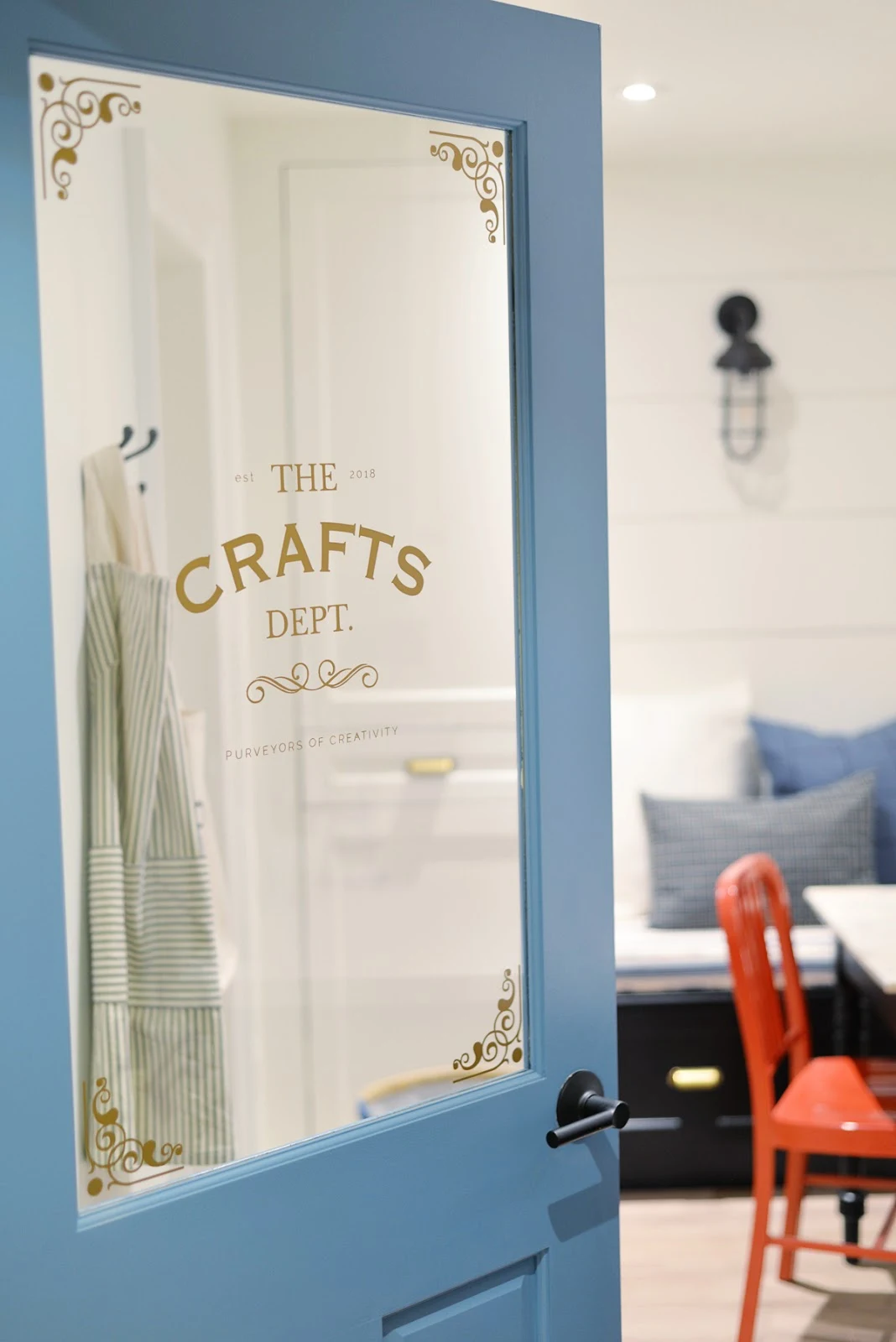 modern coastal craft room | Metrie half lite door with vintage decal | Ramblingrenovators.ca #ProjectCraftsDept | shiplap walls, coastal decor