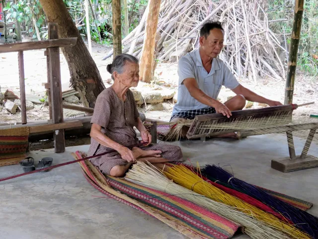93 year old lady weaving sleeping mats near Hoi An Vietnam