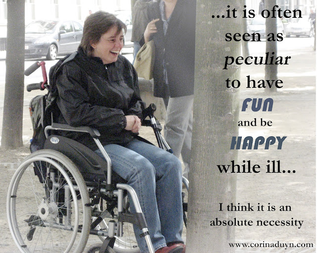 photo of Corina Duyn in wheelchair facing a tree. Laughing  with quote: It is often seen as peculiar to have fun and be happy while ill.