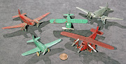 These airplanes are very small, as you can see from the penny placed . (tootsietoy airplanes )