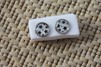 silver rimmed white with black stars