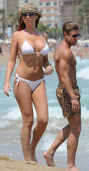 Amy Childs showed off her enviable figure in a white bikini