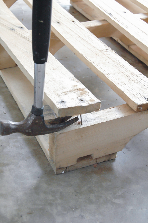 hit hammer with mallet to loosen pallet boards