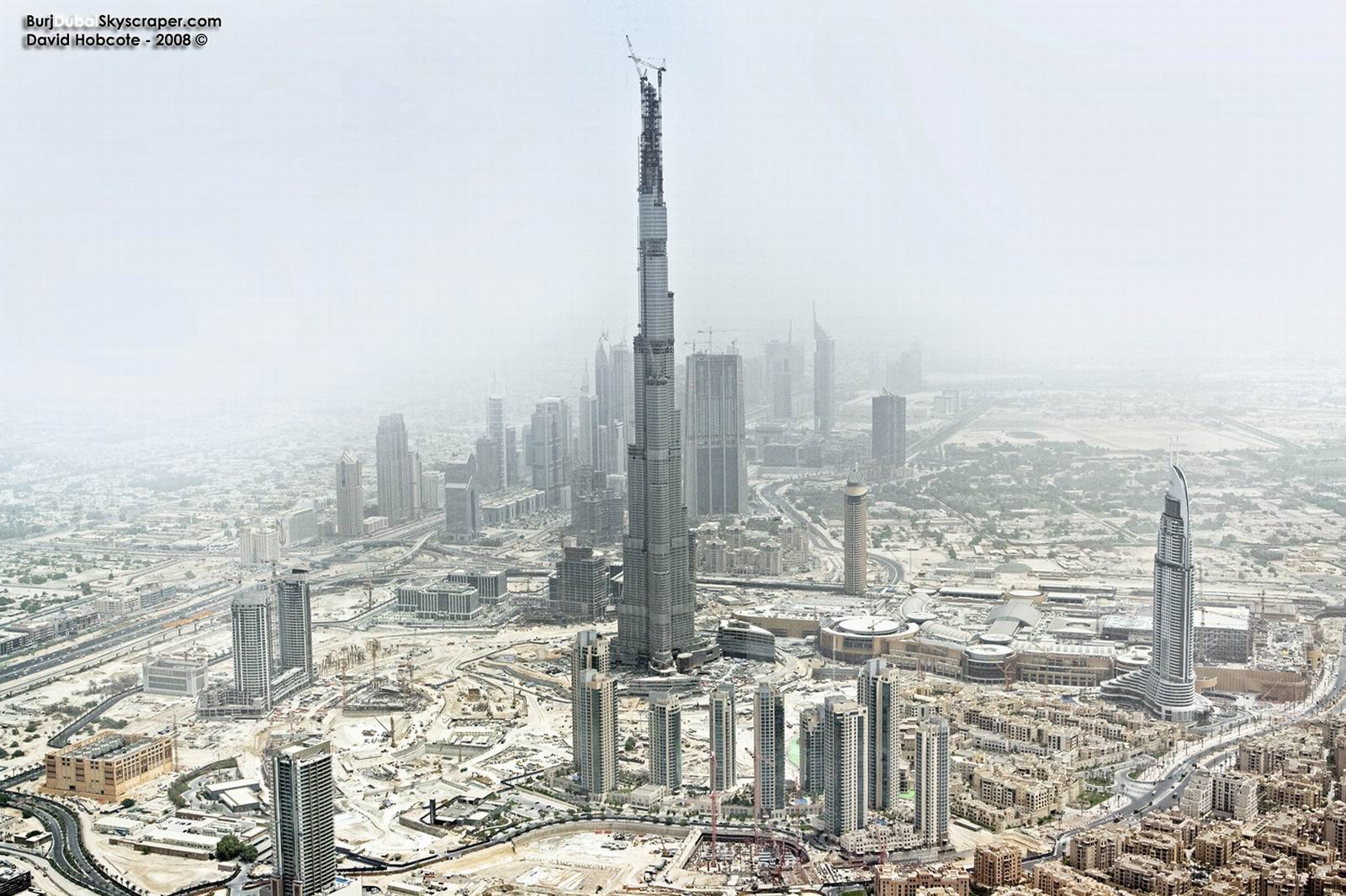 Самый высокий дом на земле. Башня Бурдж Халифа. Самый высокий небоскреб Бурдж-Халифа. Башня Бурдж Халифа стройка. Архитектор Бурдж Халифа.