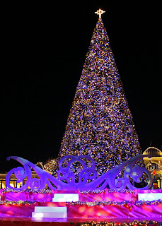 70 foot tall Christmas tree decorated with colorful lights at Winterfest at Worlds of Fun in Kansas City Missouri