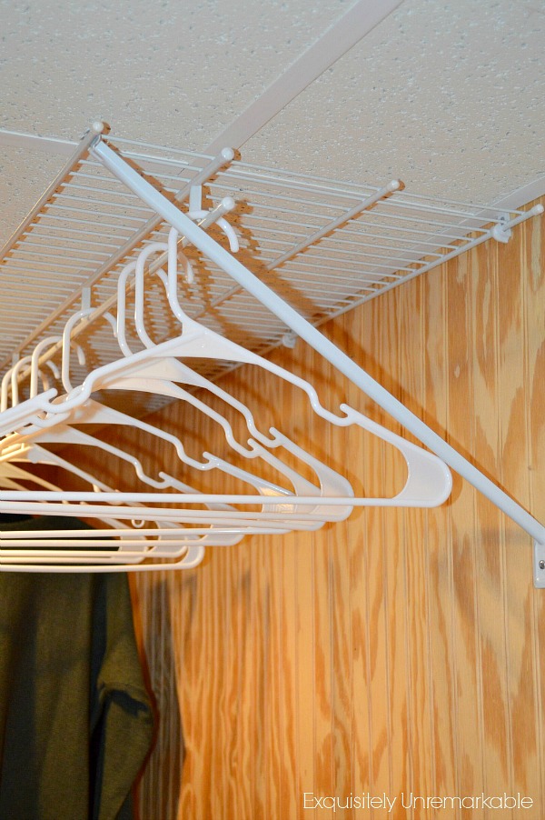 White plastic hangers in laundry room