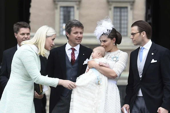 Queen Silvia and King Carl Gustaf of Sweden, Crown Princess Victoria, Prince Daniel, Princess Estelle, Princess Madeleine of Sweden with daughter Princess Leonore and Christopher O'Neill, Prince Carl Philip and Princess Sofia, Prince Haakon and Princess Mette-Marit of Norway, Crown princess Mary and Prince Frederik of Denmark, Ewa and Olle Westling at the christening of Prince Oscar of Sweden at the Royal Chapel in Stockholm.Antonio Berardi Blue Cape-back Stretch Crepe Dress