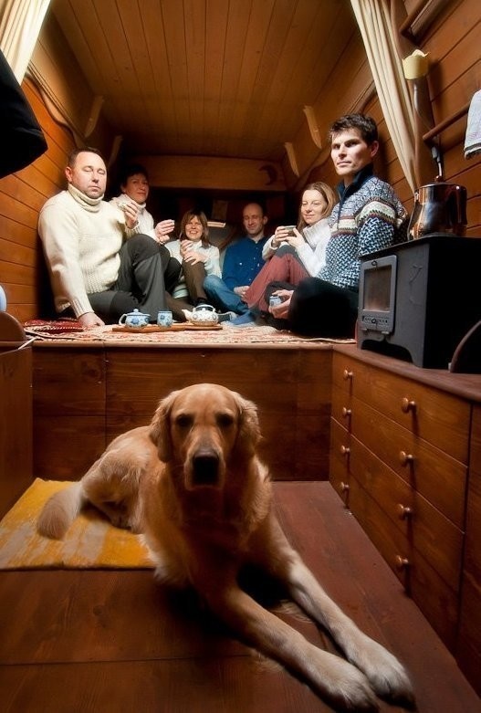 A surprising number of people - and a dog - can fit inside the tiny home. - Amazing Off-Grid Traveling Home Was Made Out Of An Old Van… Wait Till You See The Inside.