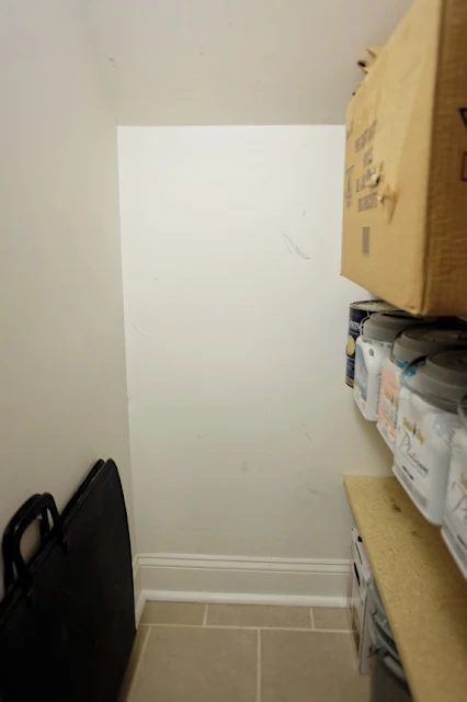 short wall under stairs in basement closet