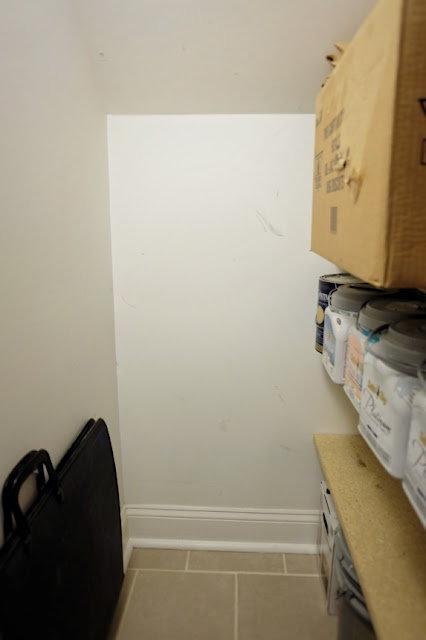 short wall under stairs in basement closet