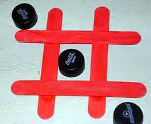 Ta te ti con palitos y tapitas