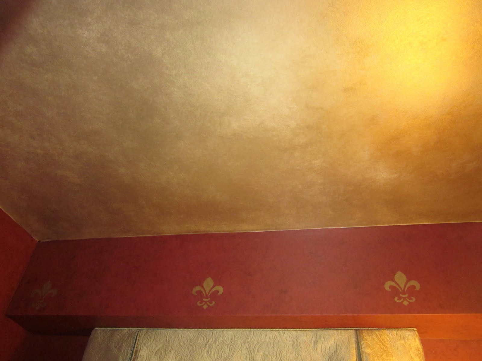 Dixon Specialty Finishes LLC Gold ceiling in powder room.