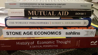 Stack of books for the course