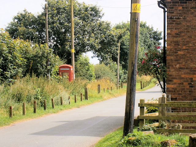old fashioned red phone box british heritage countryside 
