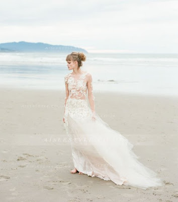 http://www.aislestyle.co.uk/34-long-sleeved-floral-lace-trimmed-tulle-coast-wedding-dress--p-7111.html