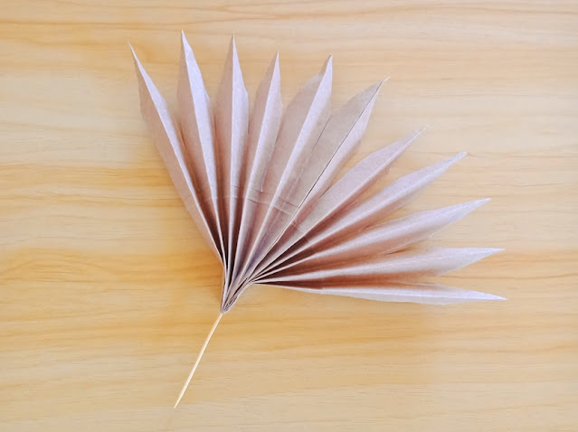 single palm frond made of paper