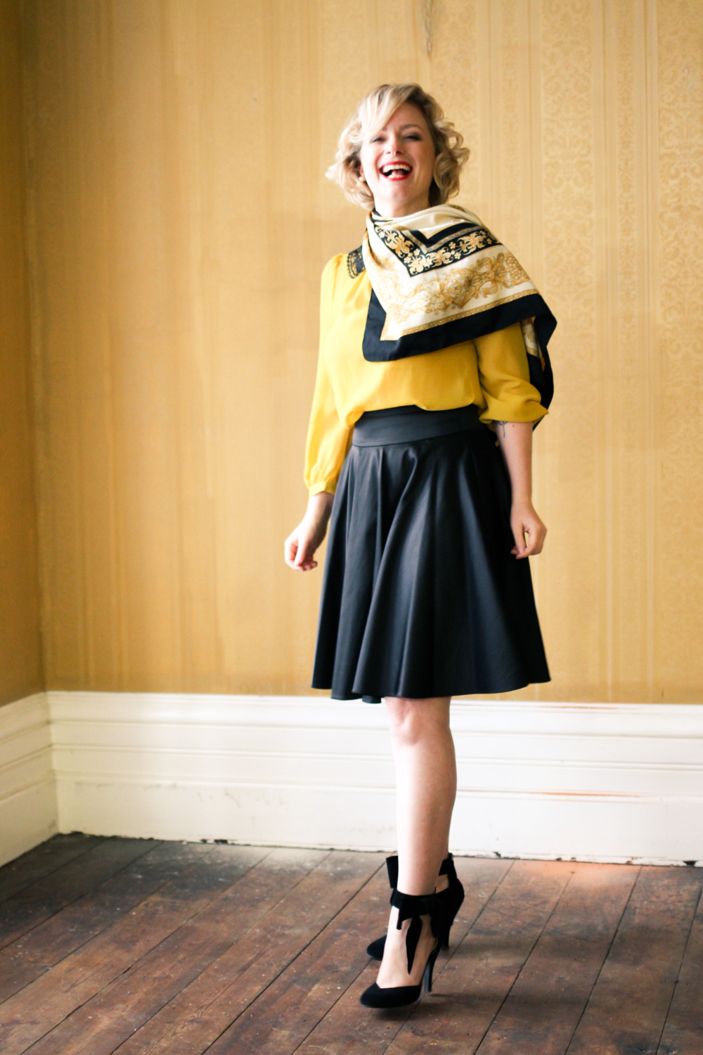 @findingfemme in yellow blouse with black lace collar, black Review Australia skirt, black bow heels and classic scarf.