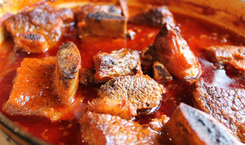 Short ribs cooking in the pot. Braising the Short Ribs