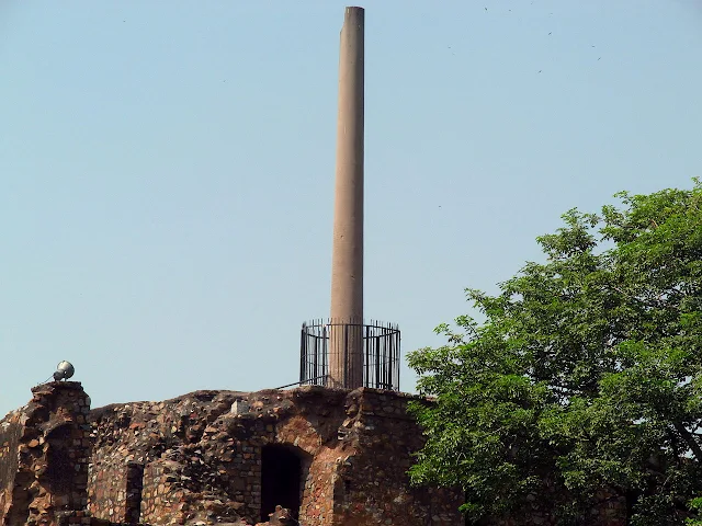 The Asoka Pillar on top of a three-storey building