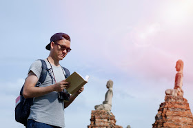 Young man traveling through Asia, language learning