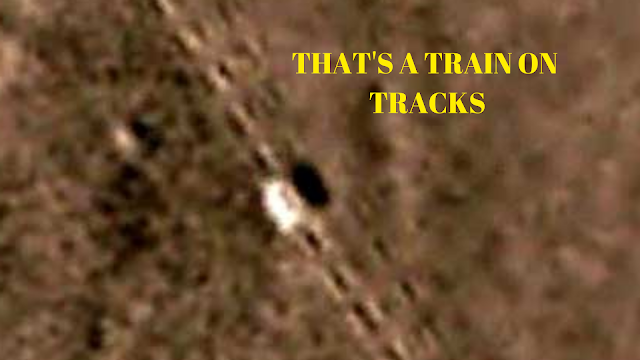 That is most definitely a train on it's own tracks but it's on Mars.