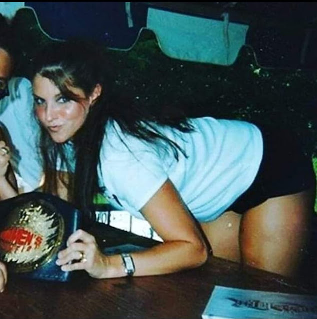 A younger Stephanie McMahon when she was the WWE women’s champion. StrengthFighter.com