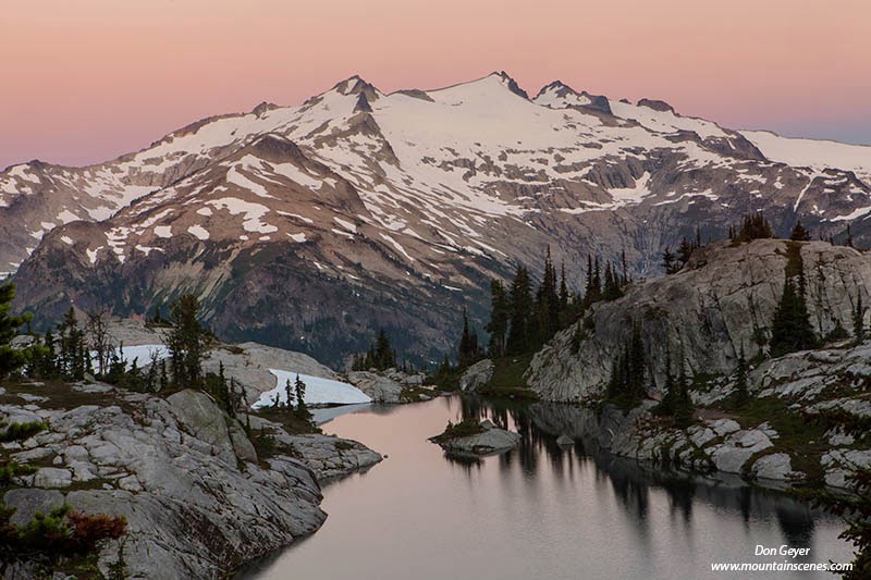 Mount Daniel and pink skies above Lower Robin Lakes in the Alpine Lakes Wilderness, Cascade Range, Washington, USA.
