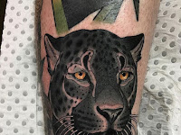 Black Panther Blue Eyes Tattoo