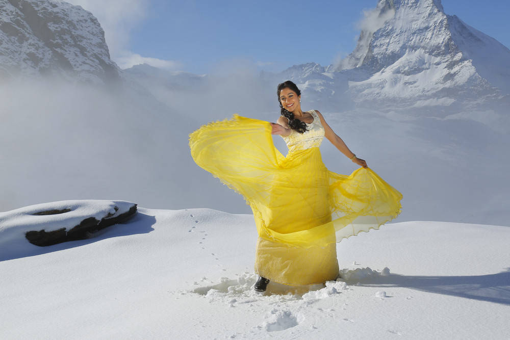 Regina Cassandra Stills From Soukyam Movie In Yellow Dress