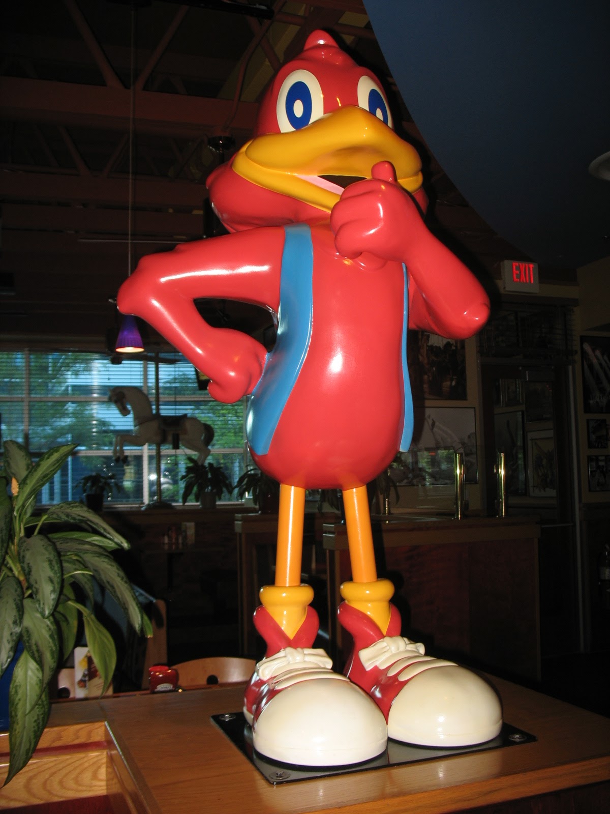 This large red bird is a little scary.. good thing the food is so tasty!