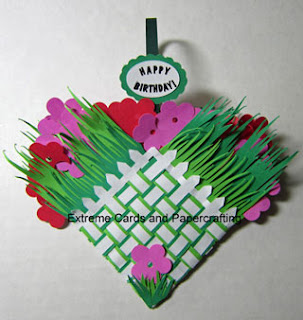 finished woven heart basket with flowers and grass