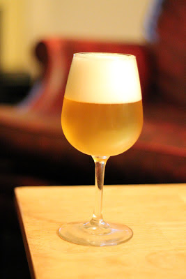 A glass of spelt saison fermented with White Labs Saison III.