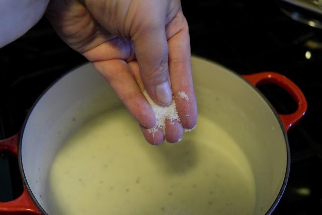 Salt being added to the sauce.