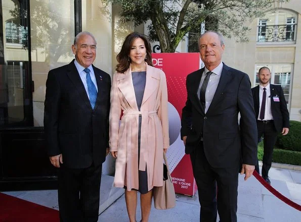 Crown Princess Mary attended the opening of OECD forum at Oecd Conference Centre in Paris. wore Prada dress Gold earrings