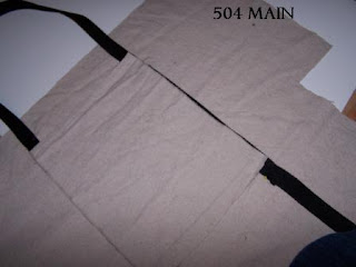 The side pocket pinned to the fabric on the exterior of the bag.