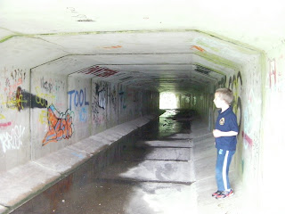 graffiti in storm drain concrete tunnel