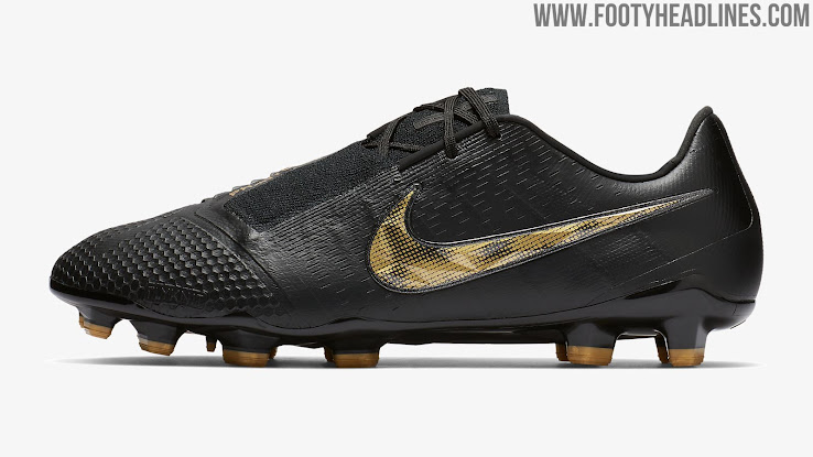 black nike football boots with gold tick