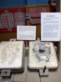 Display showing how metal toys are finished.