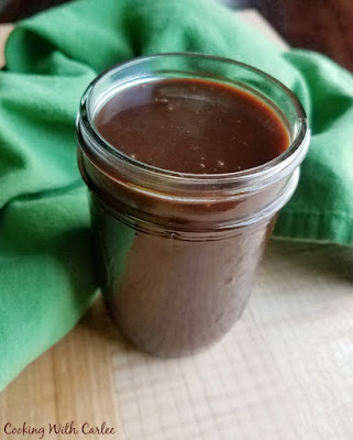 This hot fudge comes together in minutes with ingredients you probably have on hand. It is the perfect ice cream topping! jar of hot fudge sauce