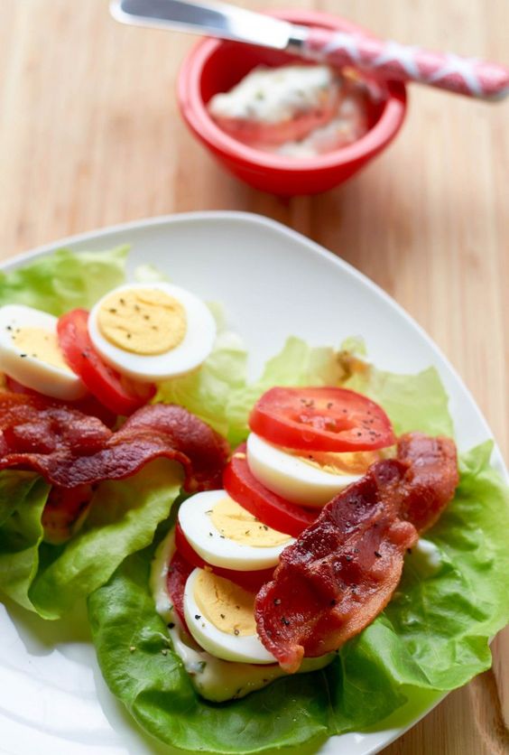Enjoy the flavors of a BLT sans bun with our lettuce wrap version which encases savory bacon in a refreshing blanket of lettuce and tomatoes. A smear of lemon aioli escalates lettuce wraps to another level. Serve with a hardboiled egg for more calories and protein.