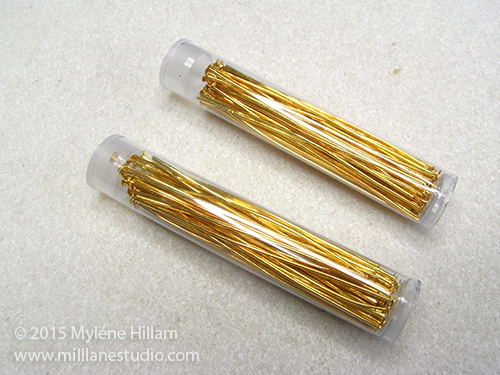 Clear seed bead tubes filled with straightened head pins