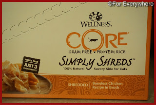 A box of Wellness CORE Boneless Chicken Grain-Free Wet Cat Food Toppers.
