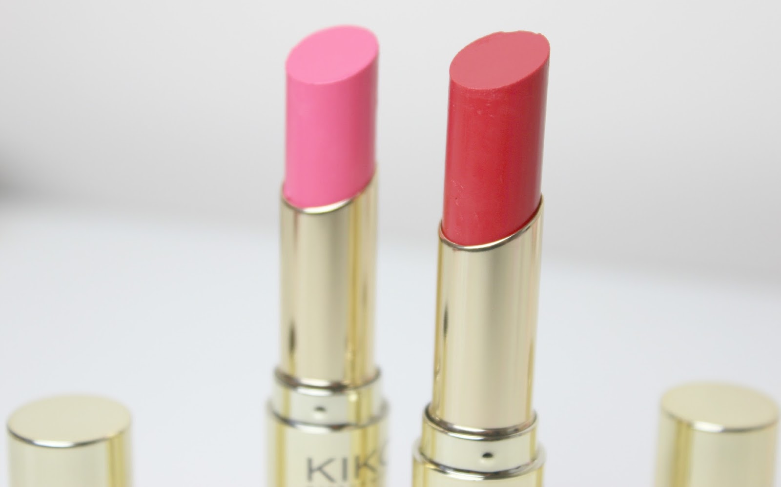 A picture of KIKO Exotic Shine Lipsticks in Amazon Red and Voluptuous Pink