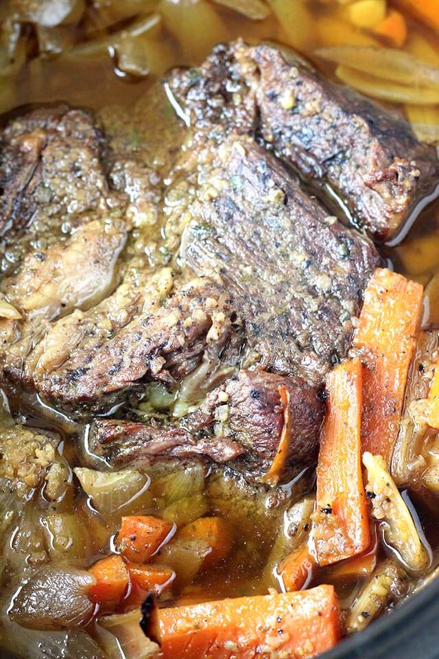 Fall-apart-tender pot roast cooked in the crock-pot with root vegetables and homemade onion soup mix. This super easy recipe takes about 20 minutes to prep and can be made in as little as 4-5 hours on the high setting. Serve with your favorite mashed potatoes for the best comforting meal.