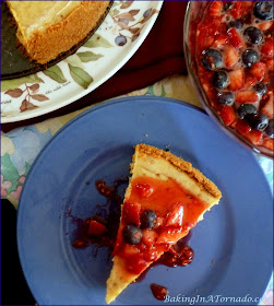 Nothing says summer like berries, and they’re bursting with fresh flavor on Cinnamon Cheesecake with Mixed Berries. | Recipe developed by www.BakingInATornado.com | #recipe #bake