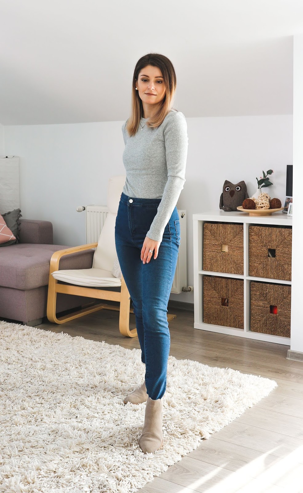 grey ribbed top with jeans and camel ankle boots