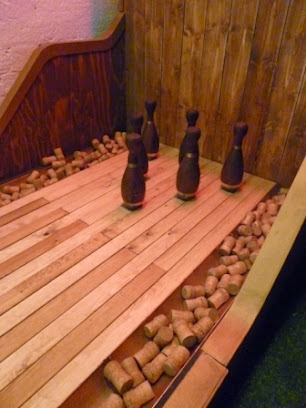 The six wooden Freixenet bottles you have to knock down to win Swingers Crazy Golf in Shoreditch, London